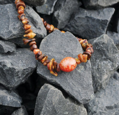 Irregular coral strand accented with blown-glass focal bead. $35.