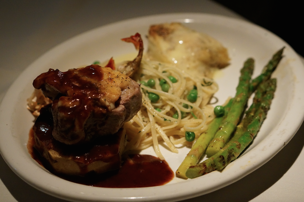 Lemon pasta with peas, Chilean sea bass, filet mignon in demi-glaze, and grilled lobster. Photo: Joanna O'Leary