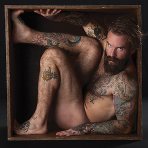 Focusing on themes of isolation, desire, conflict, and empowerment, photographer Ron Amato’s series and upcoming book, The Box, speaks to human experiences of self-discovery and community building. LaDuke is among the models photographed.