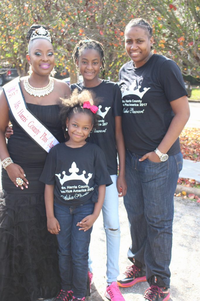 Aisha Stewart (l), her wife, Sarah (r), and their two children.