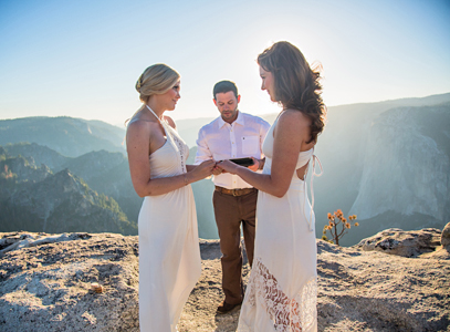 Higher Love: Chlesea Marvos (l) and Lauryn Bohac say their vows in the sunset light of a peak in Yosemite National Forest.