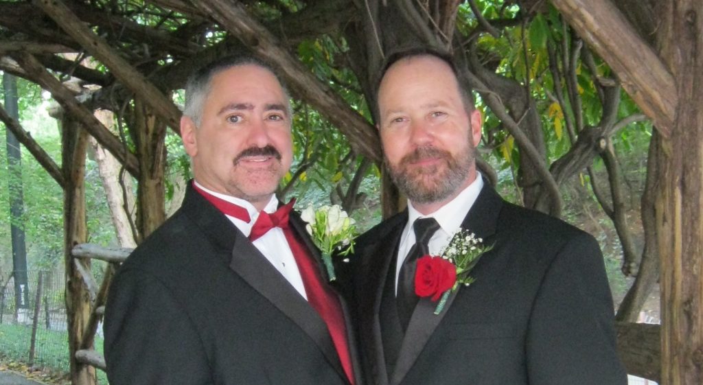 Bret Detillier, left, and Colin Riley were married on a boathouse on the lake in New York City’s Central Park.