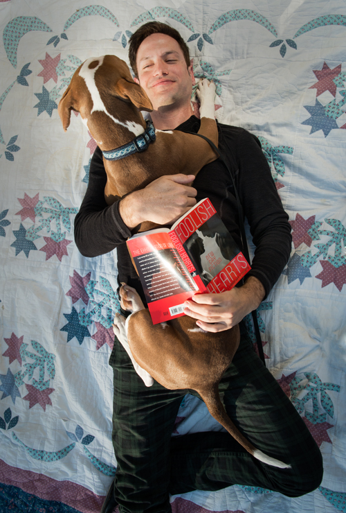 Puppy love: author Timothy Lambert is co-founder of the Rescued Pets Movement, an organization that has helped almost 900 of Houston’s homeless pets. Here Lambert is seen with Stouffer, a Rescued Pets Movement dog currently available for adoption. More information on Stouffer can be found at rescuedpetsmovement.org/adoptions/922-2. Lambert’s personal dogs are Pixie P. (Porkchop) Lambert, Penny D. (Dear) Lambert, and Pollock L.G. (Little Guy) Lambert. Photo by Theresa DiMenno.