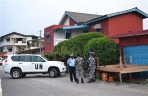 United Nations and Ivorian police stand guard outside the ransacked headquarters of Ivory Coast's most prominent gay rights organization in Abidjan, Ivory Coast. Photo: STR / AP